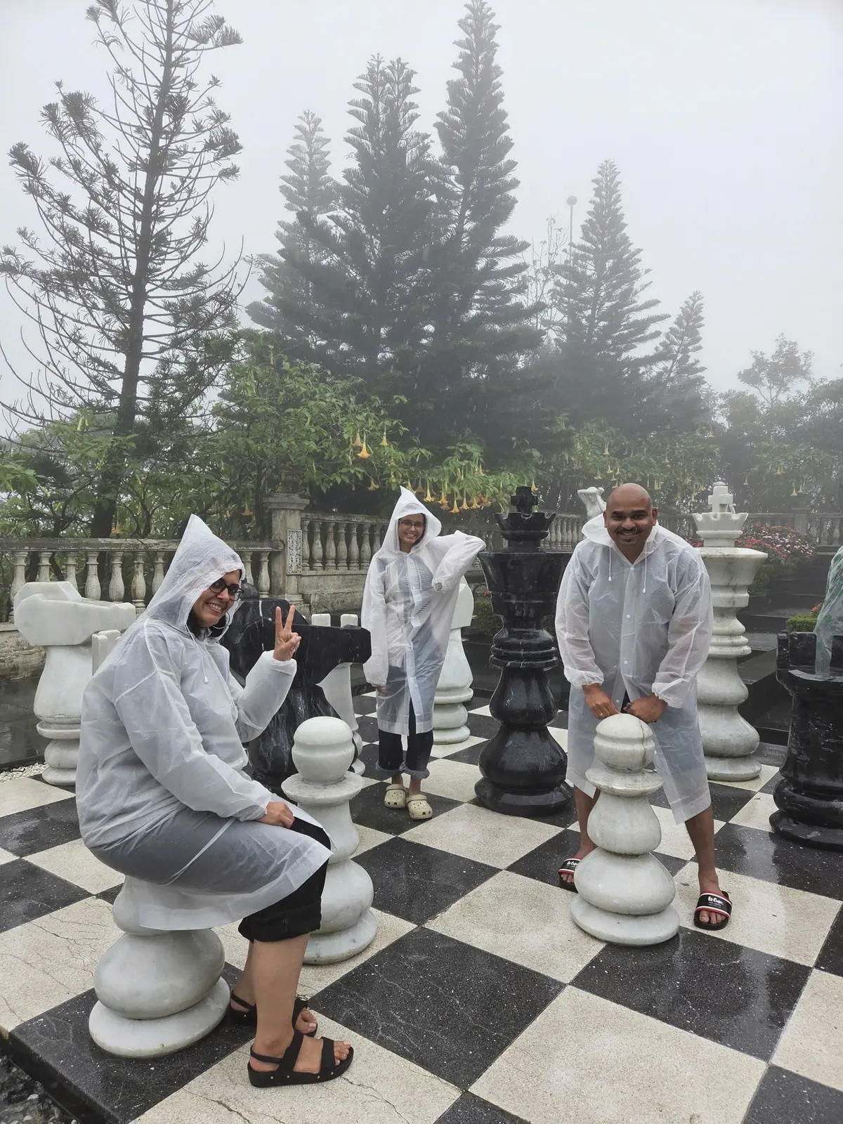 The giant chess set in the Ba Na gardens on a misty morning. Rain ponchos are sold at the top.